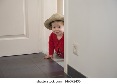 Little Toddler Playing Hide And Seek , Inside