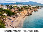 Little touristic town Nerja in Costa del Sol, Andalusia, Spain. It has many restaurants, bars and cafes. Aerial view of the beach