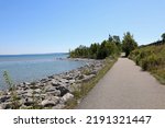 Little Traverse Wheelway is a picturesque paved trail running parallel to the Route 31. The 26-mile path stretches from Charlevoix to Petoskey to Harbor Springs, in Northern Michigan.