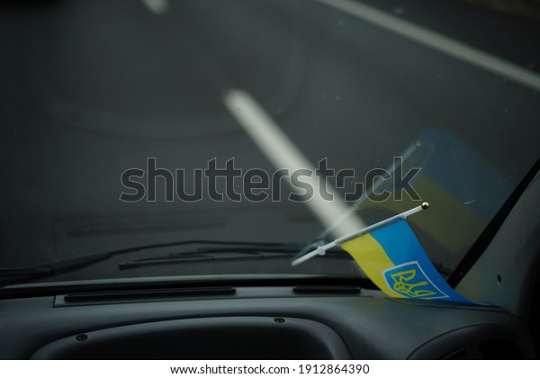 Little ukrainian flag in the\
car