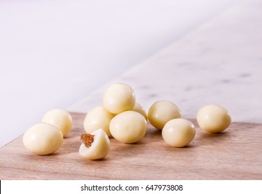 Little White Chocolate Ball With Raisin Inside - Stock Image