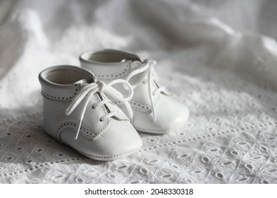 Little White Vintage Baby Shoes. New Born, First Steps, Baptism Concepts.