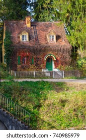 Little Wooden Fairy Tale House In A Tree Trunk. 