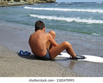 Little Young Boy On A Sand Beach In Swimfin Flippers During Summer Vacation