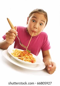 Little Young Girl Eating Pasta On White Background.