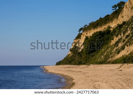 A little-known sandy beach with a steep coastline on the Baltic Sea in the Kaliningrad region