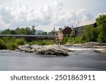 Littleton New Hampshire and the Riverwalk Covered Bridge over the Ammonoosuc River. Long Exposure Photo.