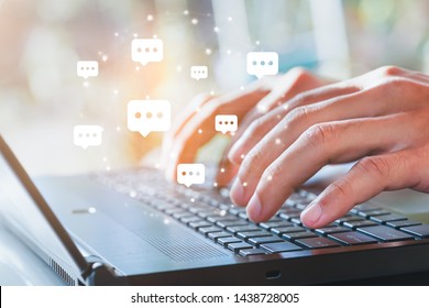 Live Chat Chatting And Social Network Concepts, Close-up Hands Typing On Keyboard Laptop With Chat Box Icons