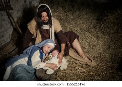 Live Christmas nativity scene in an old barn - Reenactment play with authentic costumes.  The baby is a (property released) doll.