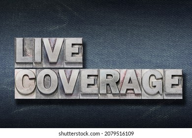 Live Coverage Phrase Made From Metallic Letterpress On Dark Jeans Background

