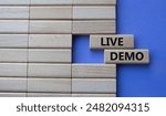 Live Demo symbol. Concept word Live Demo on wooden blocks. Beautiful purple background. Business and Live Demo concept. Copy space