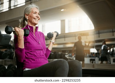 Live, laugh, love, lift. Portrait of a happy senior woman working out with weights at the gym. - Powered by Shutterstock