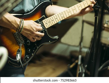 Live Man Playing Electric Guitar In A Live Band