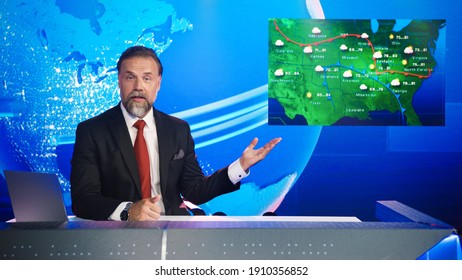 Live News Studio Professional Anchor Reporting on Weather Forecast. Weatherman, Meteorologist, Reporter in Television Channel Newsroom with Video Screen Showing Weather Synoptic Map Chart for U.S. - Shutterstock ID 1910356852