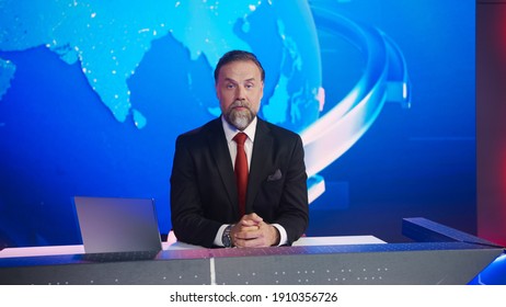 Live News Studio With Professional Male Newscaster Reporting On The Events Of The Day. Broadcasting Channel With Presenter, Anchor Talking. Mock-up TV Newsroom Set With News Ticker.