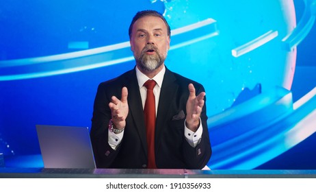 Live News Studio With Professional Male Anchor Reporting On The Events Of The Day. Broadcasting Channel With Presenter, Newscaster Talking. Mock-up TV Newsroom Set.