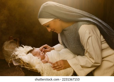 Live reenactment Christmas nativity scene of the real mother of an 8 days old baby boy playing Virgin Mary and baby Jesus