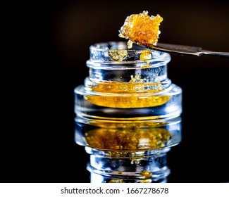 Live Resin Dab Sauce Cannabis Oil Macro with Jar Isolated Legal California Extracts from Weed Dispensary