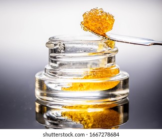 Live Resin Dab Sauce Cannabis Oil Macro with Jar Isolated Legal California Extracts from Weed Dispensary