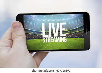 Live Streaming Mobile Concept: Hand Holding An Live Streaming Sports Event On A  3d Generated Smartphone. Screen Graphics Are Made Up.