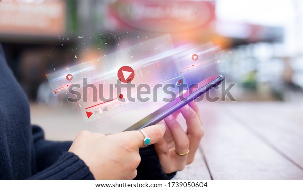 live video content online streaming\
marketing concept.close-up of Hands holding mobile\
phone