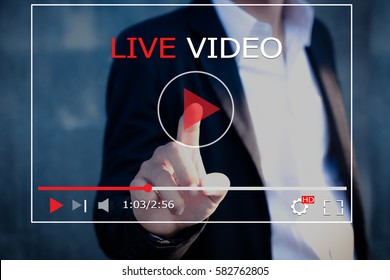 Live video,streaming concept.Business man press a play buttons