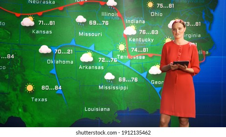 Live Weather News Studio with Professional Female On-Camera Meteorologist Standing Beside Screen and Making Gestures to Point at Weather Synoptic Map Chart for United States of America - Shutterstock ID 1912135462