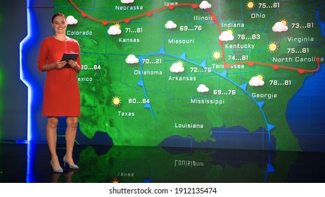 Live Weather News Studio with Professional Female On-Camera Meteorologist Standing Beside Screen and Making Gestures to Point at Weather Synoptic Map Chart for United States of America - Shutterstock ID 1912135474
