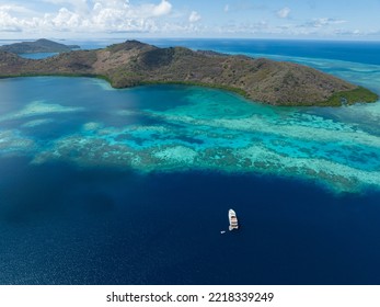 A Liveaboard Dive Boat Drifts Along The Edge Of A Reef At Pulau Besar, North Of Flores, Indonesia. This Region Is Known For Its High Marine Biodiversity And Spectacular Scuba Diving And Snorkeling.