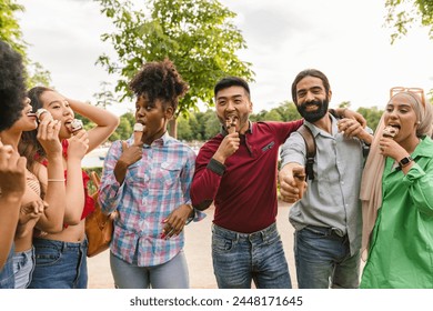 A lively and diverse group of friends share joy and ice cream on a cheerful outing. - Powered by Shutterstock