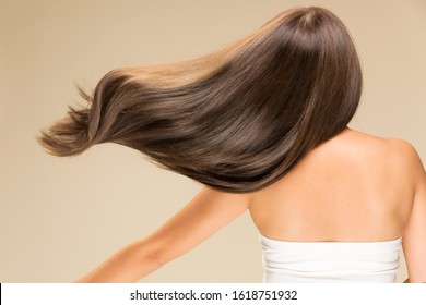 Lively hair on a beige background. - Shutterstock ID 1618751932