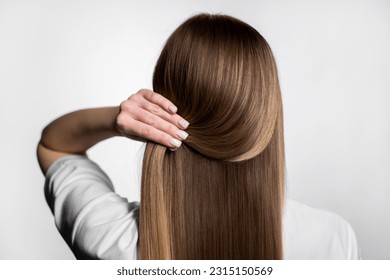 Lively hair on a beige background. - Shutterstock ID 2315150569
