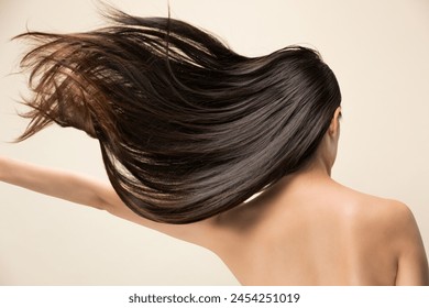 Lively hair on a beige background. - Powered by Shutterstock