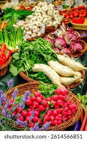 A lively market features an array of fresh vegetables including radishes, garlic, leafy greens, and colorful peppers, inviting shoppers to explore the selections.