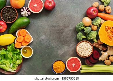 Liver detox diet food concept. Healthy eating concept for the liver, fruits,vegetables, nuts, olive oil, citrus fruits, green tea, turmeric, oats. Top view, flat lay - Shutterstock ID 1585753810