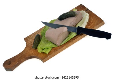 Pâté Of Liver On A Cutting Board With Pickles On A White Background