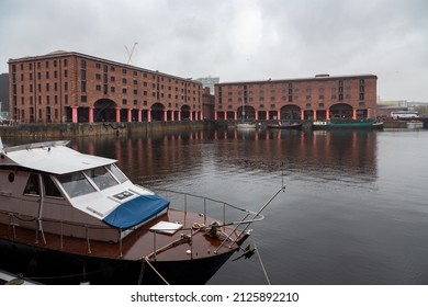 Liverpool, Merseyside, United Kingdom - June 11th 2019: Royal Albert Dock With A Vintage Motor Boat In The Foreground