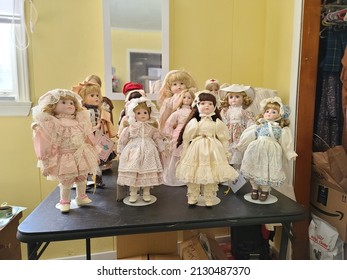 Liverpool, NS, CAN, 2.28.22 - A Collection Of China Dolls Displayed On A Table.