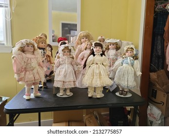 Liverpool, NS, CAN, 2.28.22 - A Collection Of China Dolls Displayed On A Table.