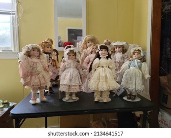 Liverpool, NS, CAN, 2.28.22 - A Collection Of China Dolls Displayed On A Table.