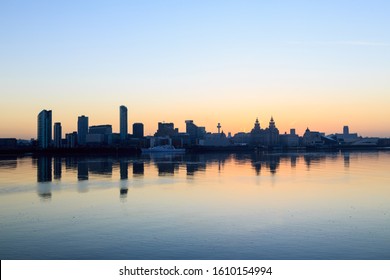 Liverpool Skyline and Waterfront at sunrise showing River Mersey, England