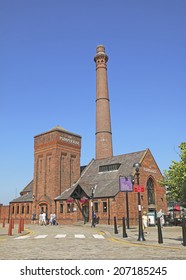 LIVERPOOL, UK - 24 JULY 2014: The Pumphouse. The Albert Dock is a complex of dock buildings and warehouses in Liverpool, England and was the first non-combustible warehouse system in the world 