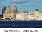 Liverpool, UK. The Three Graces viewed from the River Mersey on a ferry crossing towards Pier Head