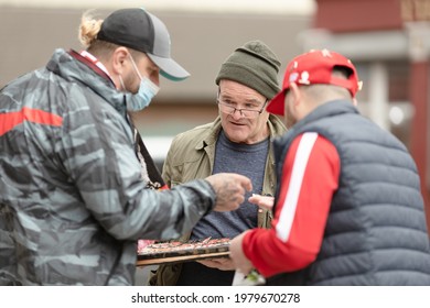 Liverpool, United Kingdom - 05.23.2021: A Street Vendor Selling Liverpool Badges Outside Anfield Stadium In Liverpool. 