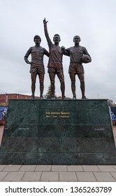 Liverpool, United Kingdom - April 9, 2019 : Statue Outside Old Trafford Depicting The United Trinity. 