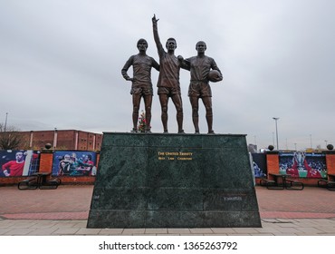 Liverpool, United Kingdom - April 9, 2019 : Statue Outside Old Trafford Depicting The United Trinity. 