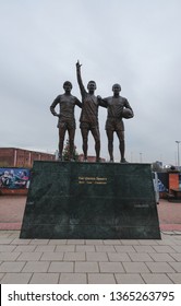 Liverpool, United Kingdom - April 9, 2019 : Statue Outside Old Trafford Depicting The United Trinity. 