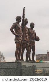 Liverpool, United Kingdom - April 9, 2019 : Statue Outside Old Trafford Depicting The United Trinity. 