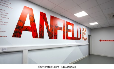 LIVERPOOL, UNITED KINGDOM - MAY 17 2018: LFC staffs and a group of its football fans take a tour in Anfield stadium, the home ground of Liverpool football club