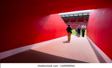 LIVERPOOL, UNITED KINGDOM - MAY 17 2018: LFC staffs and a group of its football fans take a tour in Anfield stadium, the home ground of Liverpool football club